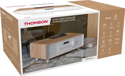 The image shows the retail packaging of a Thomson micro system, with the product visible inside.