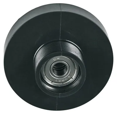 A close-up view of a black plastic pulley wheel with a metal bearing in the center.