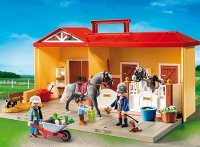 A toy horse stable playset with figures and accessories.