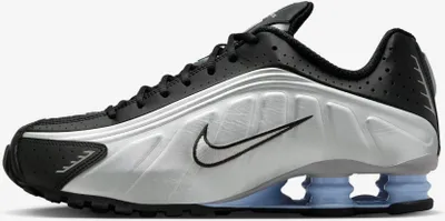 A side profile of a Nike Shox R4 sneaker.