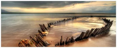 Produktbild von Wallario Wandbild aus Acryl, 200 x 80 cm, freischwebende Optik - Bootswrack in Irland am Strand