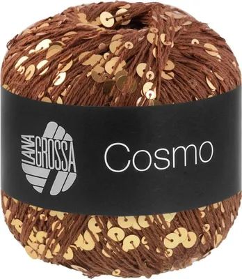 A ball of brown yarn with gold sequins, wrapped in a black label with white text.