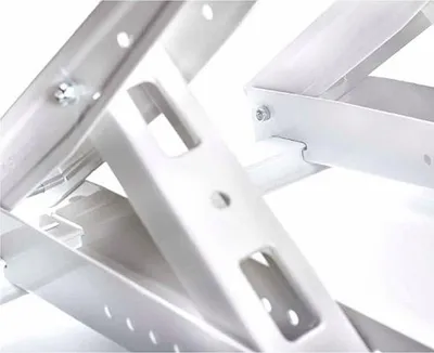 Close-up view of white metal brackets, likely for an air conditioner or similar equipment.