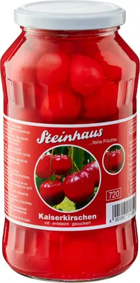 A glass jar filled with red cherries, with a label showing the brand and product details.