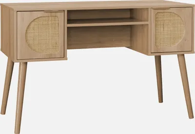 A light wood desk with rattan accents and angled legs, presented against a plain light gray background.