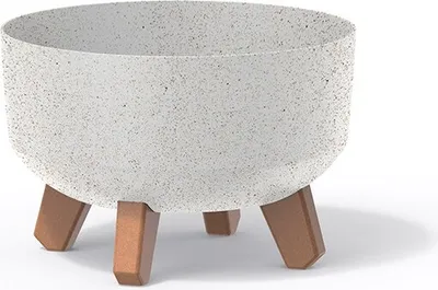 A white speckled planter pot with three brown legs.