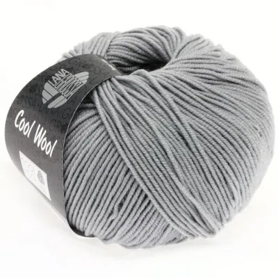 A ball of gray yarn with a label wrapped around it.