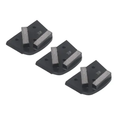 Three diamond grinding shoes are arranged diagonally on a white background.