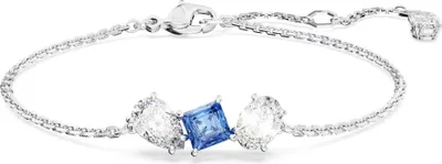 A close-up studio shot of a silver bracelet with blue and clear gemstones.