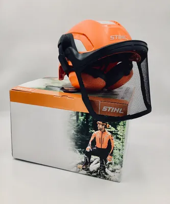 A STIHL helmet set with visor and hearing protection is displayed on top of its packaging.