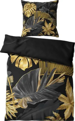 A bedding set with a tropical leaf pattern in gold and black.