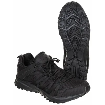 A pair of black Magnum Storm Trail lite shoes are shown against a white background. One shoe is upright, showing the sole, and the other is placed in front of it, showing the side and top.