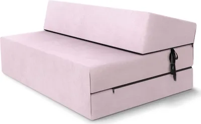 A pink folding mattress or futon sofa is shown from a diagonal angle against a white background.