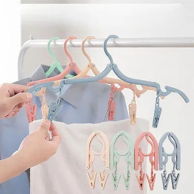 Image de Lot de 4 cintres pliables, portables et antidérapants en plastique, avec pinces, idéaux pour les voyages, disponibles en 4 couleurs