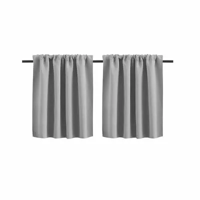 Two gray curtains hanging on a rod against a white background.