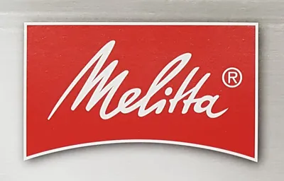 A close-up of a red label with the Melitta logo and trademark symbol.