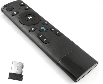 A black remote control and a USB dongle are shown against a white background.