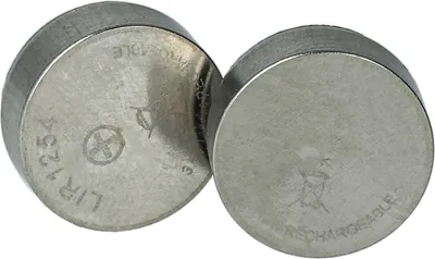 Two silver coin cell batteries are shown against a white background.