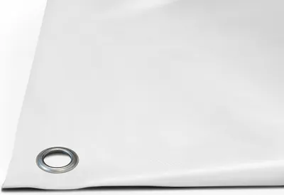 A close-up, angled view of a white PVC tarp with a metal grommet in the bottom left corner.
