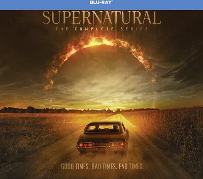 A car drives down a dirt road towards a fiery, circular phenomenon in the sky, with the text 'SUPERNATURAL THE COMPLETE SERIES' and 'GOOD TIMES. BAD TIMES. END TIMES.' displayed.