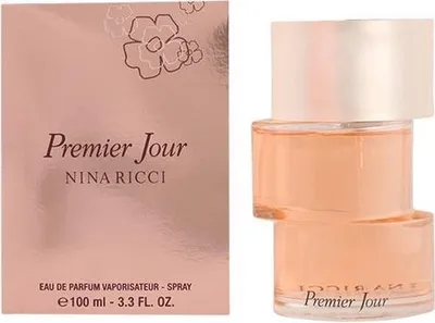 A product shot of Nina Ricci Premier Jour perfume, with the packaging on the left and the perfume bottle on the right.