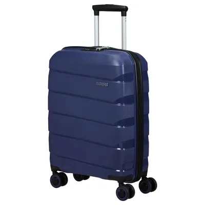 A navy blue American Tourister spinner suitcase is shown against a white background.