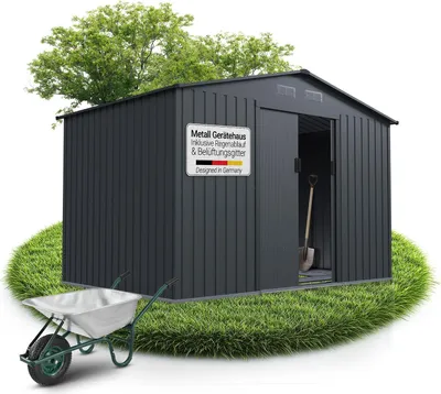 A dark gray metal shed is shown on a patch of grass, with a wheelbarrow in the foreground and a tree in the background.