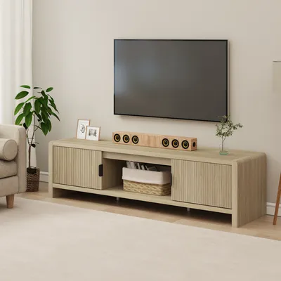 A modern living room with a TV stand and television.