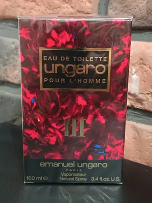 A product box for perfume, with a textured background.