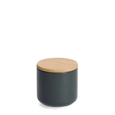 A dark gray ceramic jar with a light brown bamboo lid, isolated on a white background.