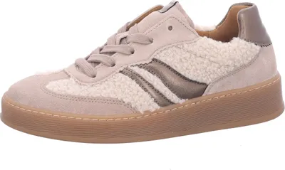 A single beige sneaker is shown against a white background.