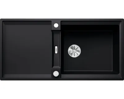 A top-down view of a black kitchen sink with a drainboard and a main basin.
