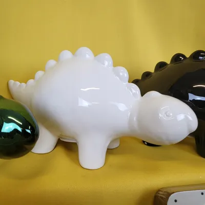 Produktbild von Ewax Keramik-Sparschwein Dinosaurier weiß Kinderdeko
