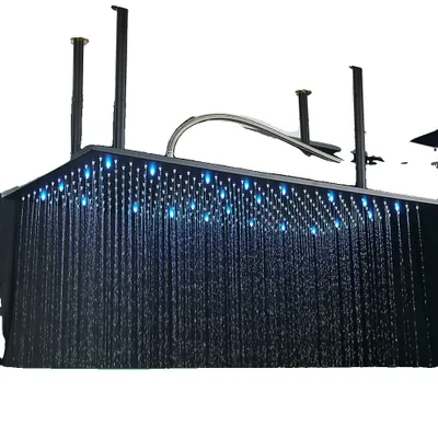 A modern, ceiling-mounted LED showerhead with water flowing and blue lights illuminated.