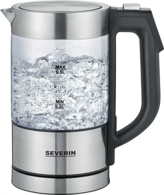 A glass electric kettle filled with boiling water.