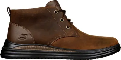 A side view of a brown leather boot.