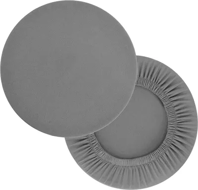 Two round fabric covers for stools or chairs, one flat and one stretched over a circular form.
