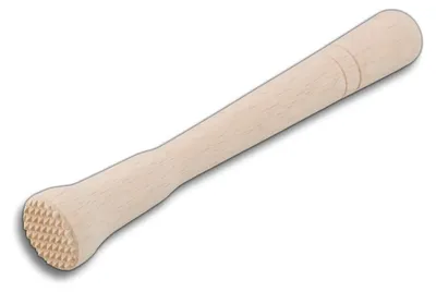 A wooden cocktail muddler on a white background.