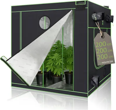 A black grow tent with green trim, partially open to reveal plants inside. A price tag is hanging from the side.