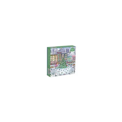 A box of a puzzle depicting a Christmas scene in a city with a large decorated Christmas tree in the center.