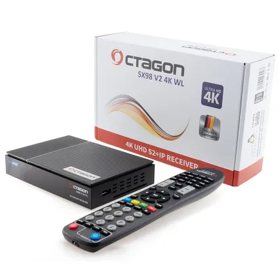 A black satellite receiver, its remote control, and its packaging are arranged on a white background.