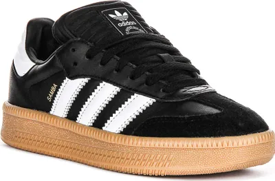 A close-up, studio shot of a single Adidas Samba Xlg shoe.
