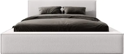 A white upholstered bed with gray bedding and pillows, presented against a white background.