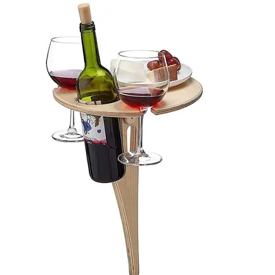 A portable wine table with glasses and a bottle of wine.