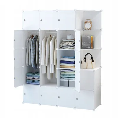 A modular white closet filled with clothes and accessories.