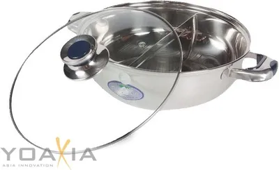 A stainless steel hot pot with a glass lid.