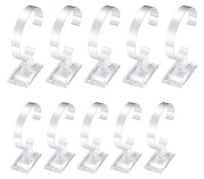 Imagen del producto de 10 soportes transparentes para relojes, ideales para tiendas o uso doméstico