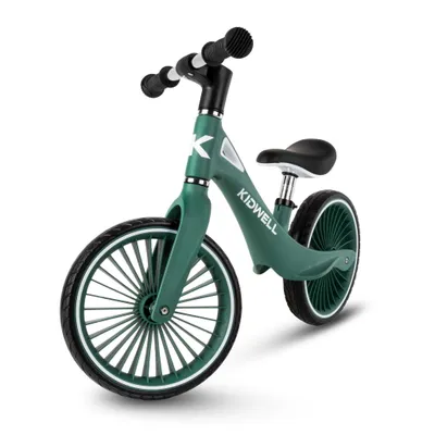 A green balance bike on a white background.