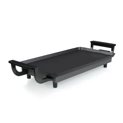 A black electric griddle is shown from a slight angle against a white background.