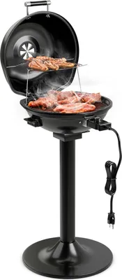 A black electric grill with food cooking on it, shown on a white background.